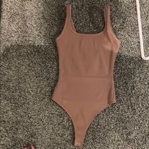 Naked Wardrobe Tan Bodysuit. Missing inner tag